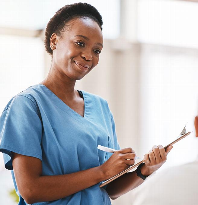 Female care worker with checklist